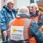 Three Trustees of Living Options Devon at an outdoor event