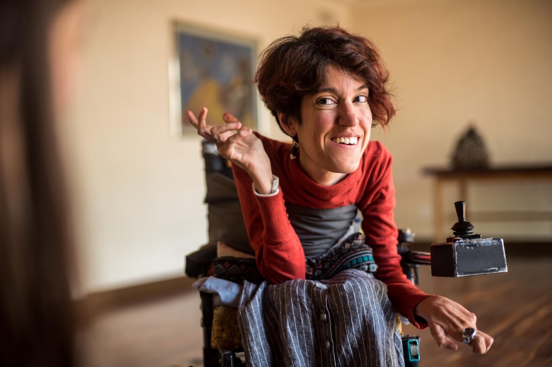 Woman in wheelchair smiling