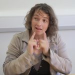 Woman signing in british sign language