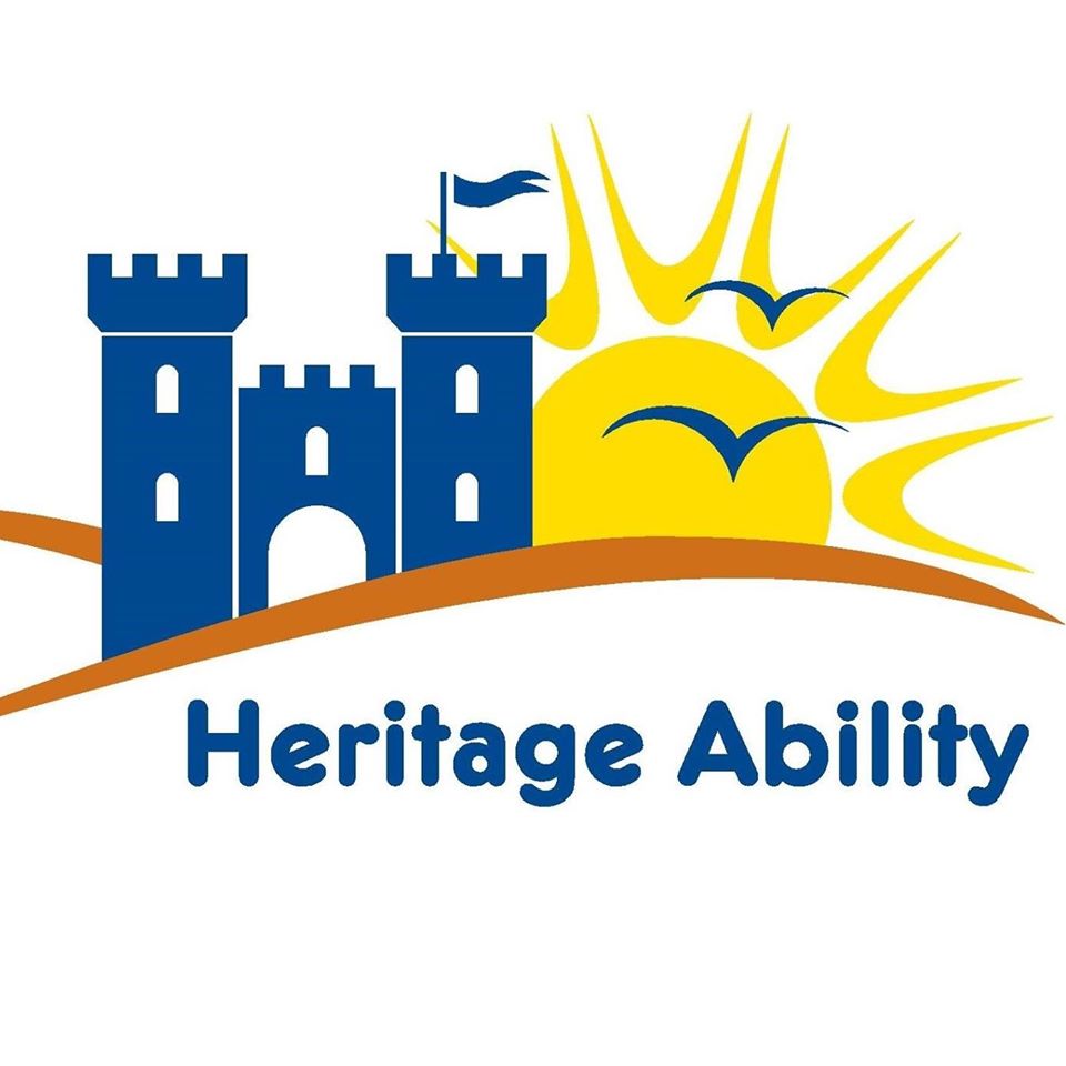 Heritage Ability logo showing blue castle on a brown hill with the Living Options Devon sun rising behind