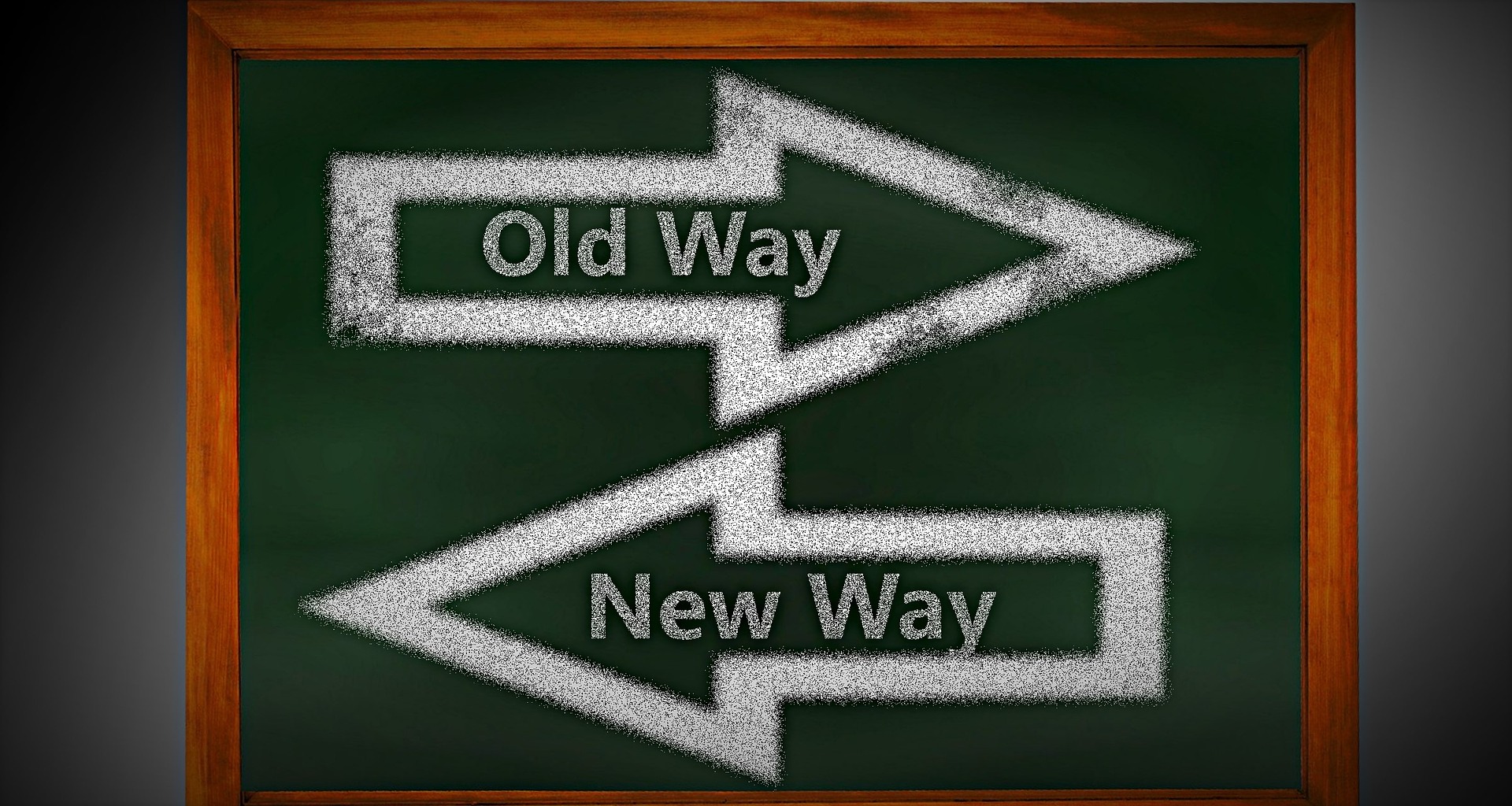 A sign with one arrow pointing to the old way and another pointing to the new way.