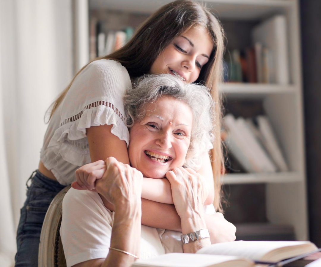 Sensory Loss - grandaughter hugs her smiling grandmother