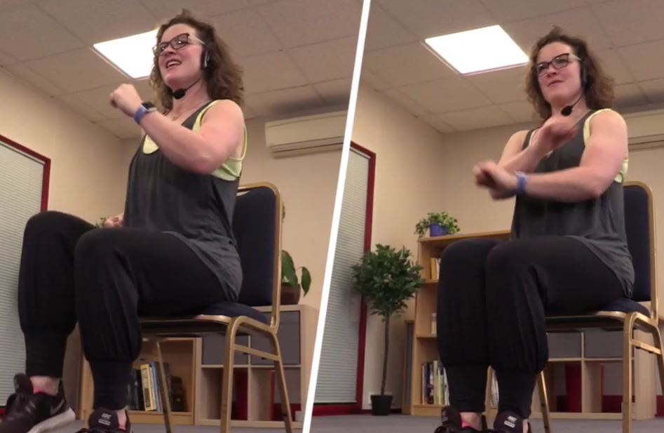 Woman indoors doing seated exercise