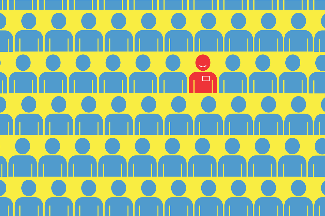 graphic design image, blue outline of lots of people on yellow background with one red with a smiley face.