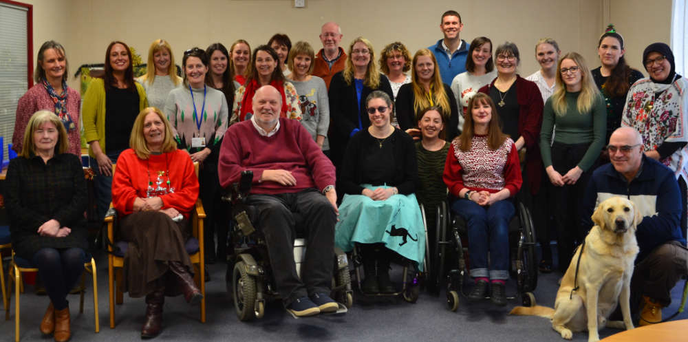 A group of Living Options Devon staff at the Exeter Office