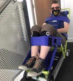 Disabled man being rescued in an emergency stairway