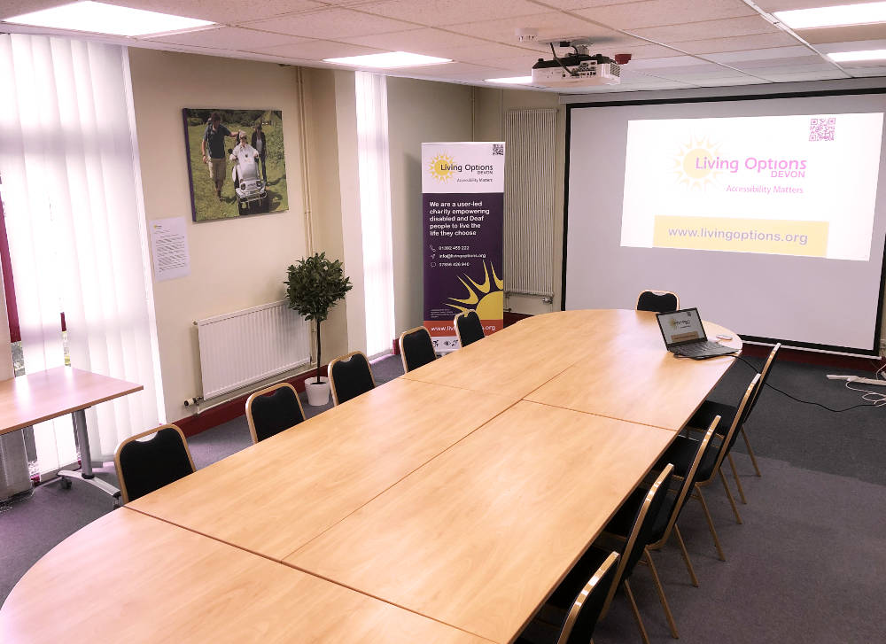 The Swan meeting room with projector, screen, large oval table