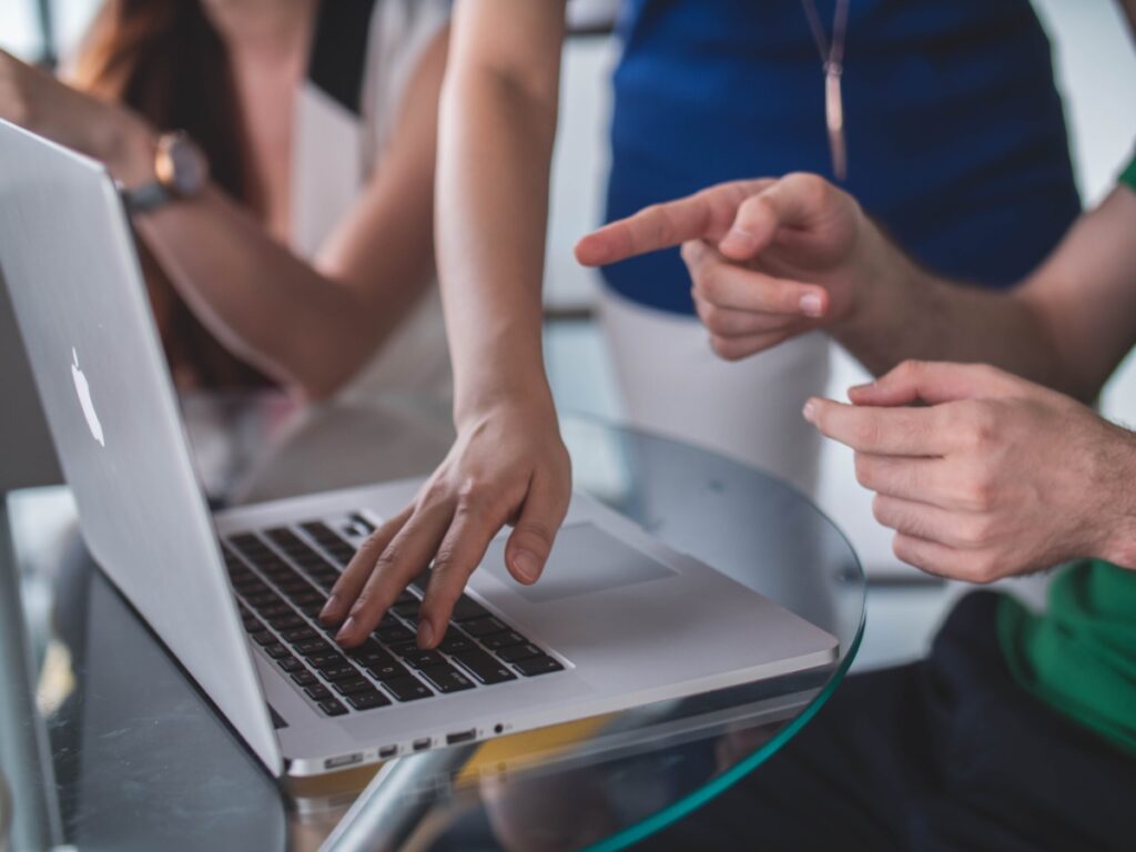 People discussing over a laptop