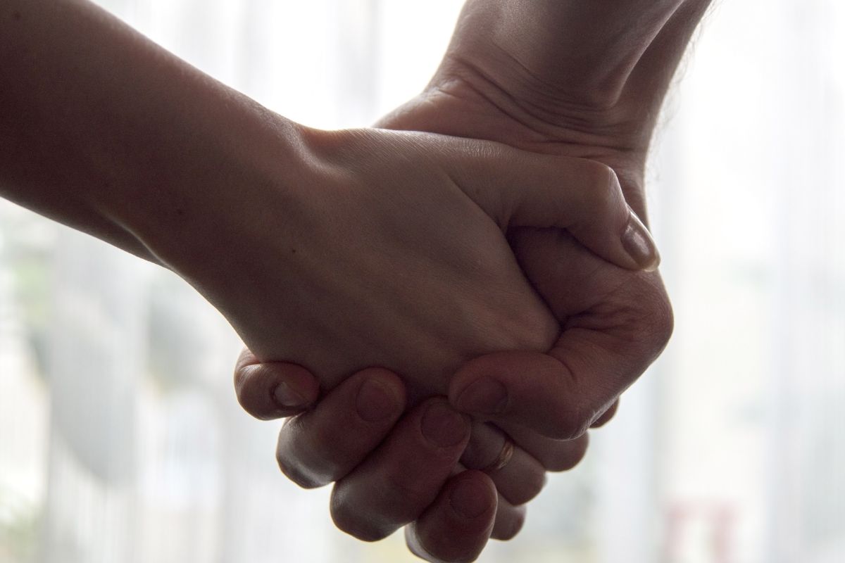 A close up of two hands held