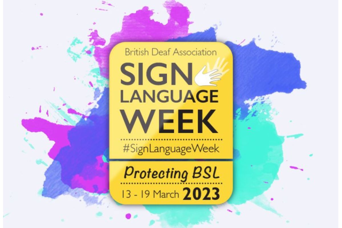 The sign language week logo which includes signing hands symbol against a colorful splash of background colours