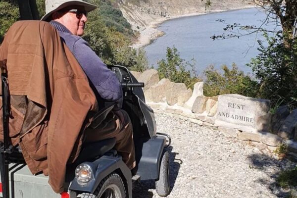 David, on a Tramper overlooks a cliff top and takes in the view