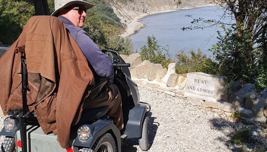 David, on a Tramper overlooks a cliff top and takes in the view