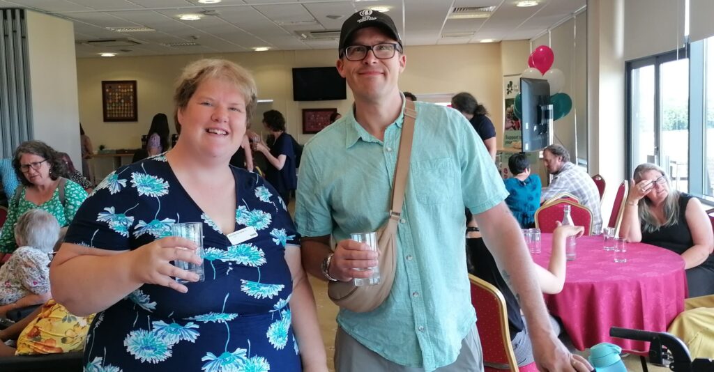 Heidi and Sam are smiling at the event.