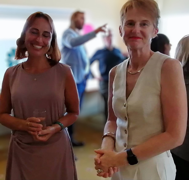 One of our counsellors, Kiera, stands with Susan. They smile at the camera
